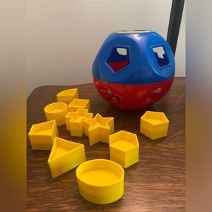 Tupperware sort of shape toy.